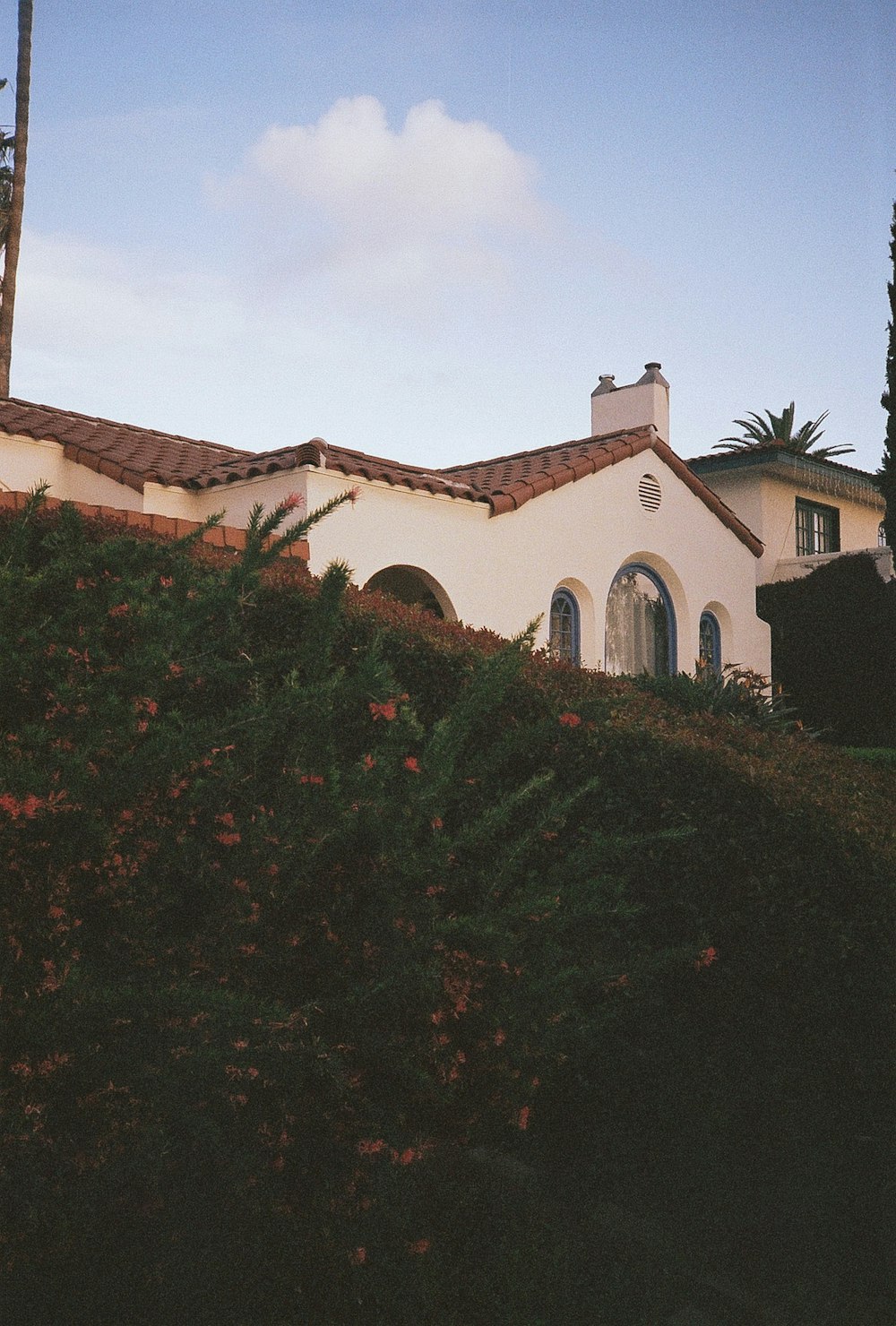 a house with a clock on the front of it