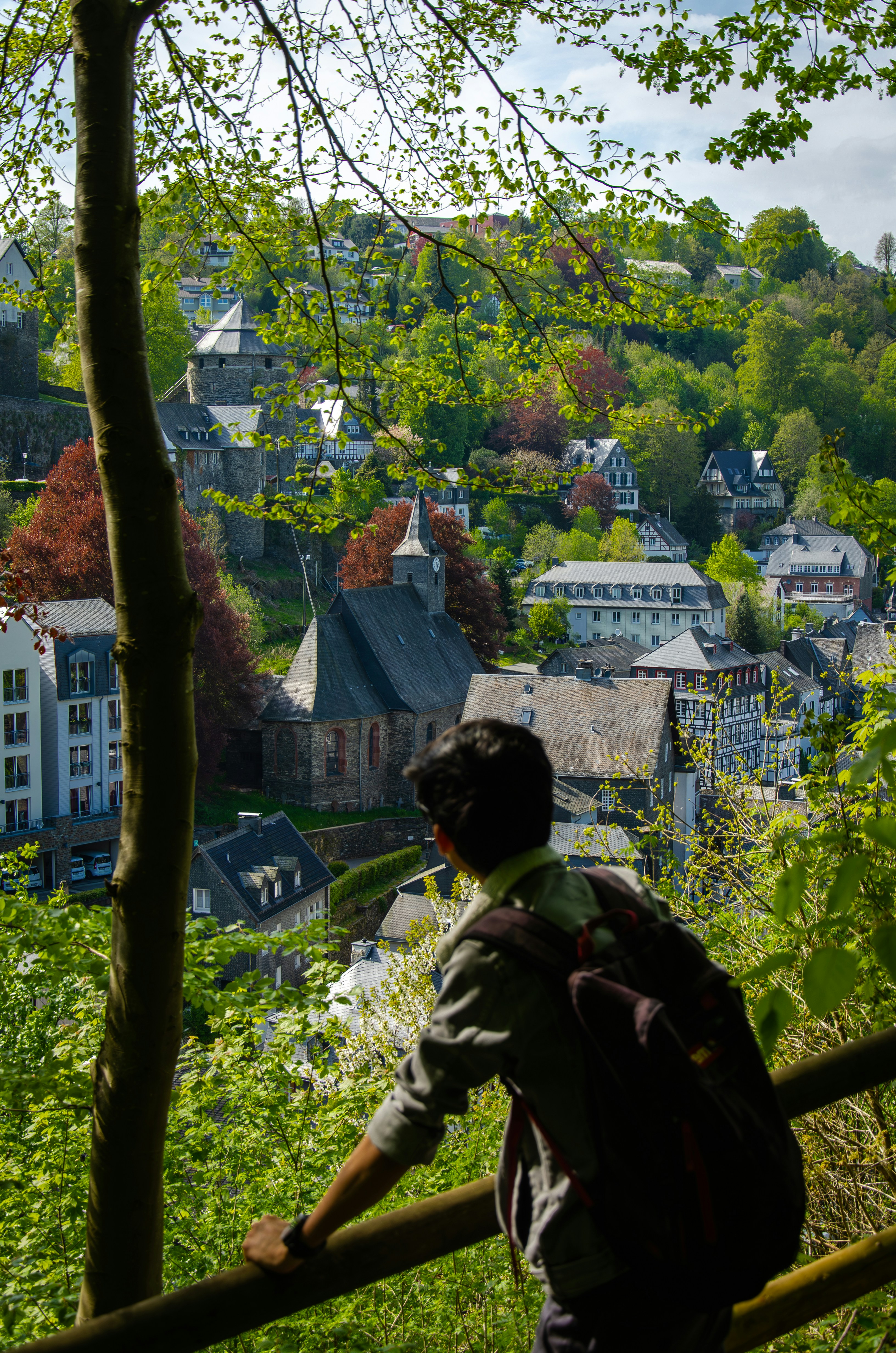 a person with a backpack walking up a hill