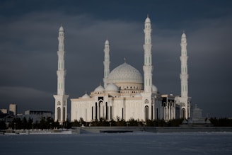 a large white building with two towers on top of it