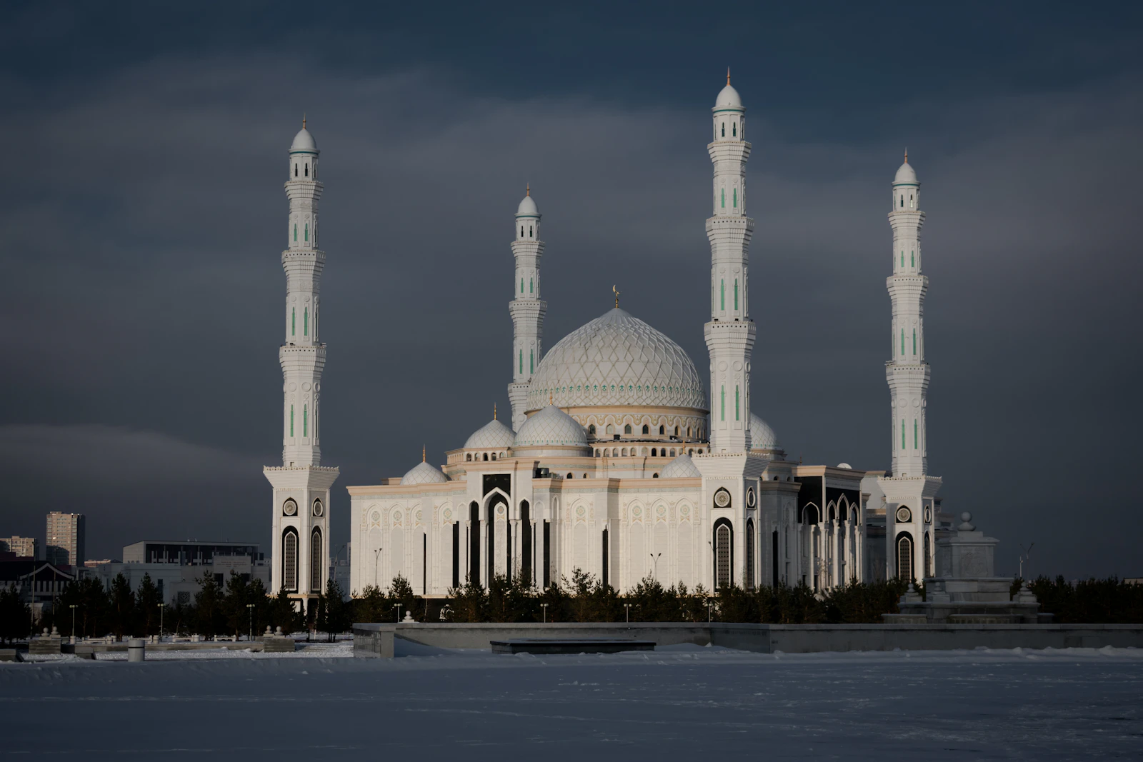 The white Hazrat Sultan mosque in Astana under a grey steppe sky