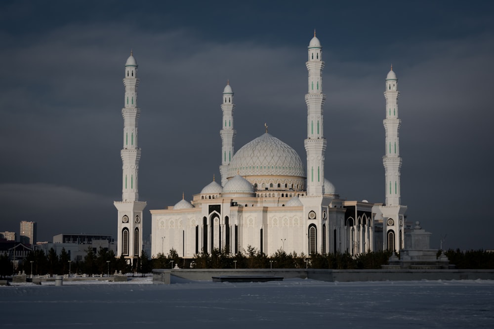 a large white building with two towers on top of it