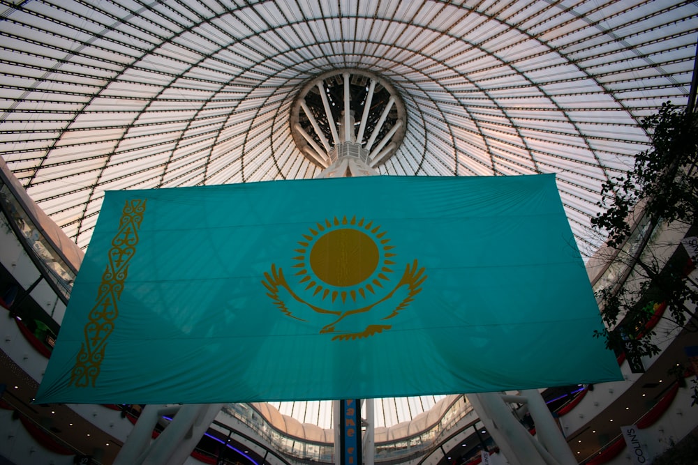 a large flag is hanging in a building