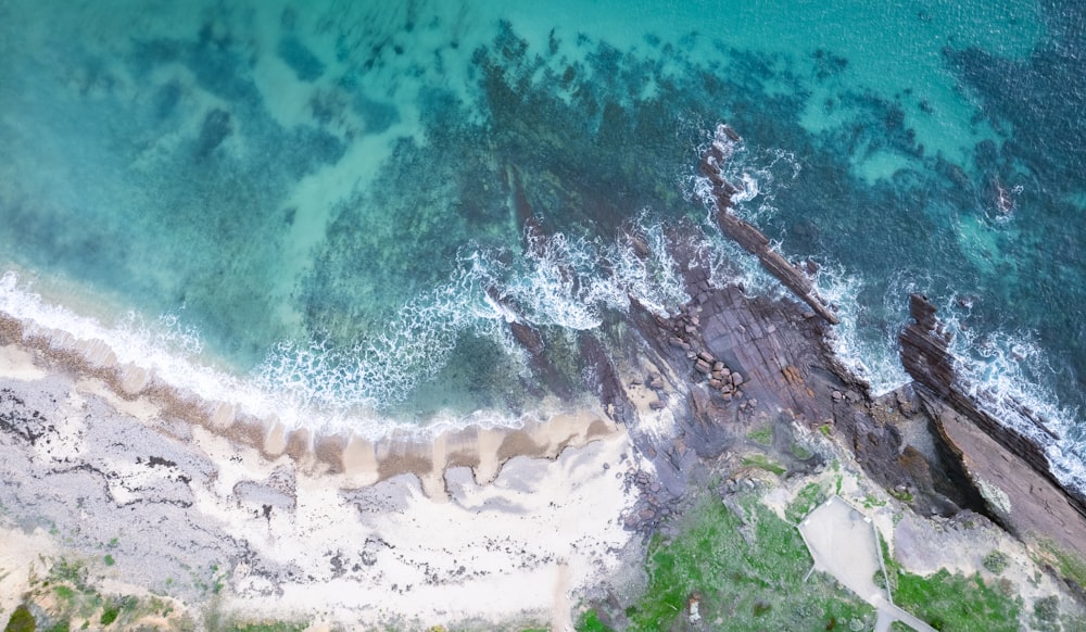 an aerial view of a beach and ocean