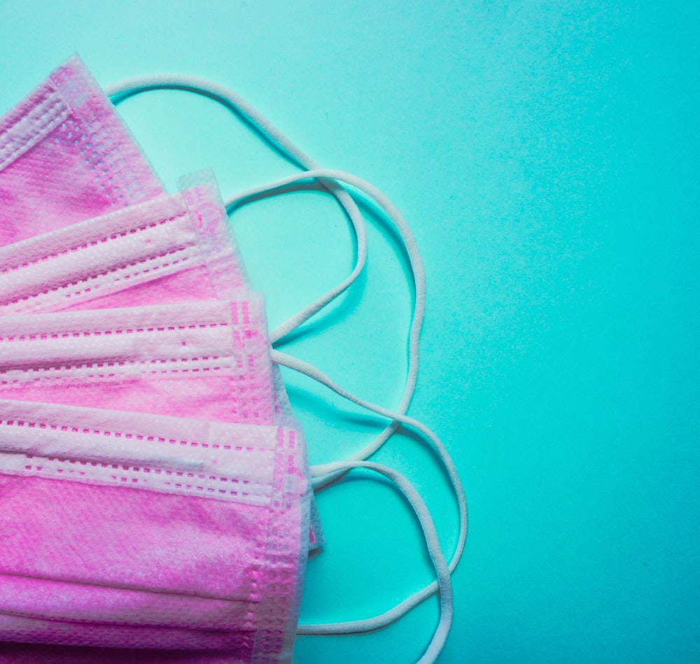 a pair of face masks on a blue background