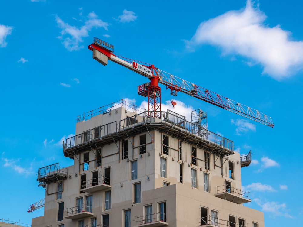 a crane on top of a tall building