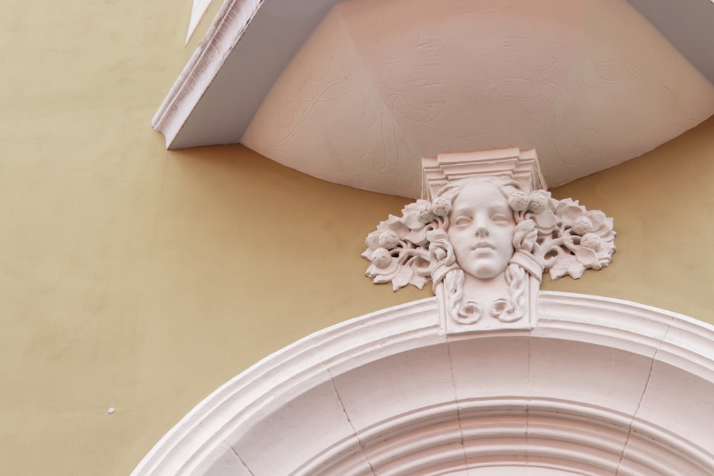 a close up of a face on the side of a building