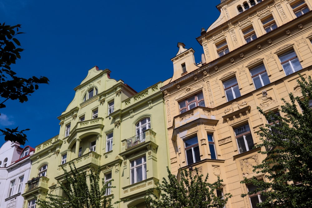 a row of multicolored buildings on a sunny day