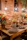 A colorful assortment of mini cakes on a rustic wooden table with natural light