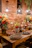 A colorful assortment of mini cakes on a rustic wooden table with natural light