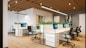 Contemporary office interior featuring sleek wooden desks and open layout.