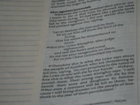 A close-up view of a page from a printed book, displaying text in a serif font. The text is laid out in paragraph form, with each line justified accordingly. The page includes a heading in bold, with some parts of the text also emphasized by bold typography. Margins are present, and the page seems to have a slightly yellowish tone, suggesting it may be from a book with an aged or classical appearance.