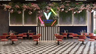 A chic lounge setup with vibrant lighting and stylish decor for a girls' night party.