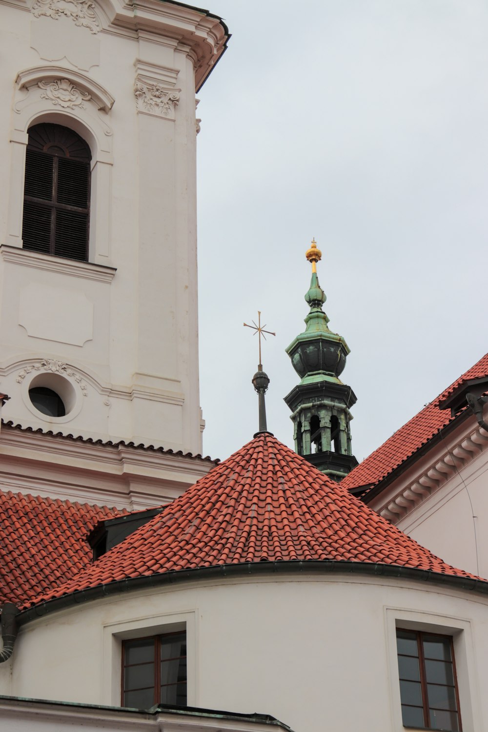 a building with a steeple and a cross on top