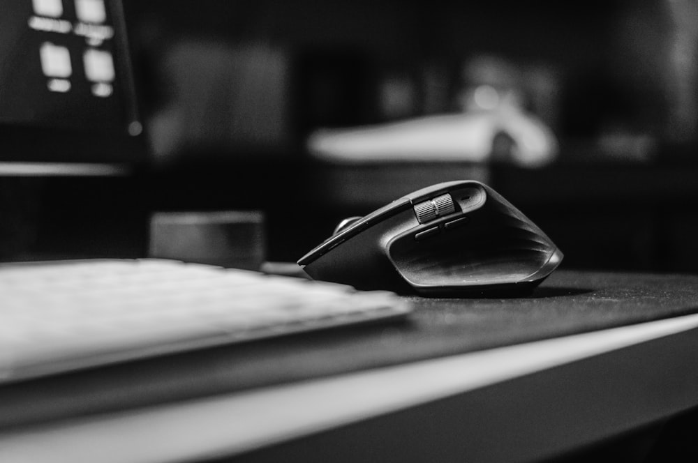 a black and white photo of a mouse and keyboard
