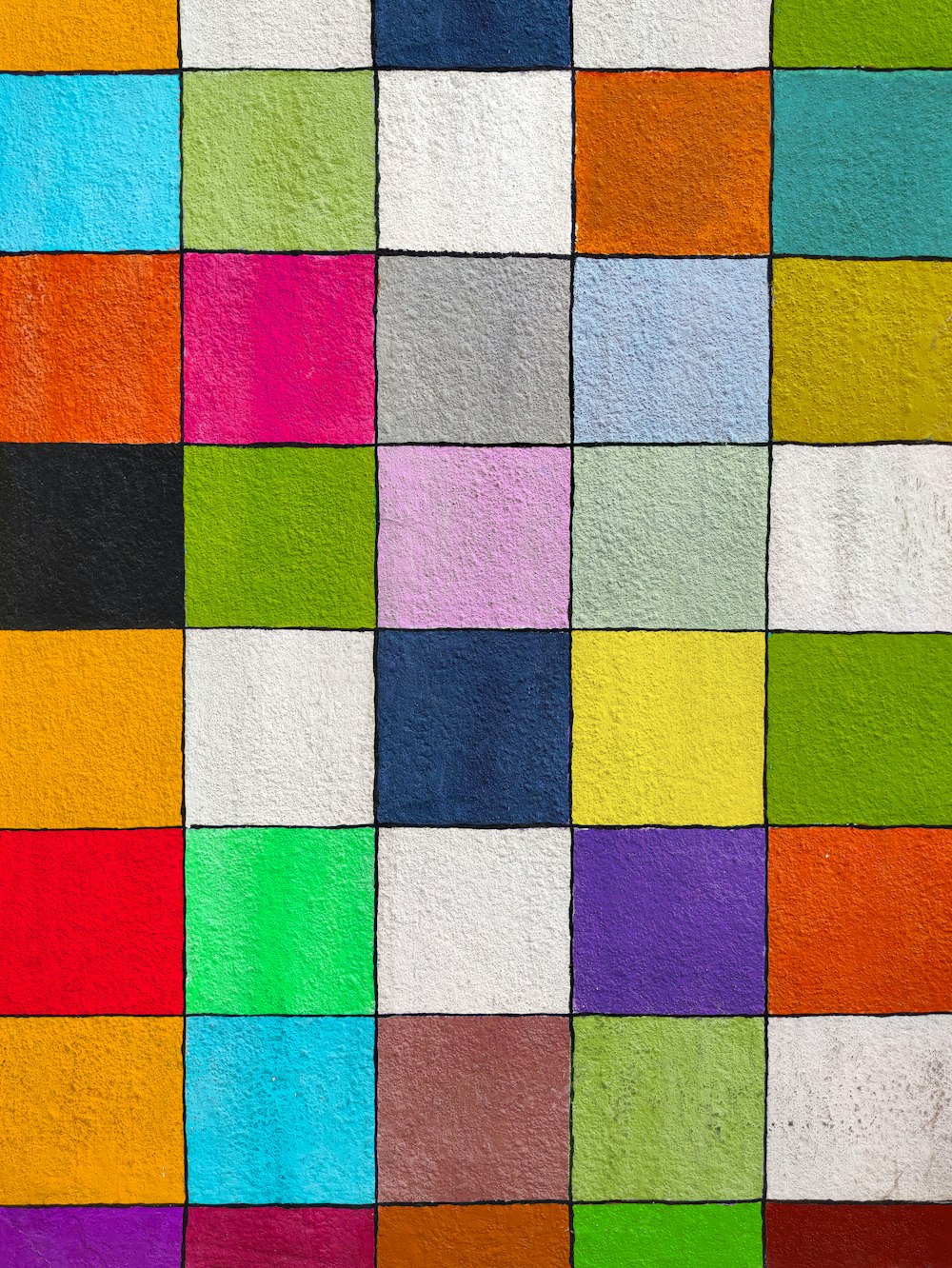 a multicolored painting of squares of different colors