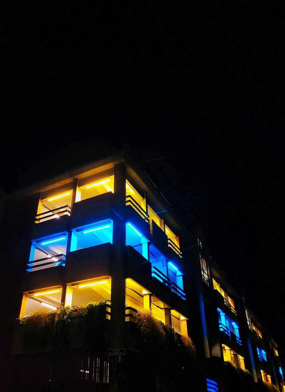 a building lit up with blue and yellow lights