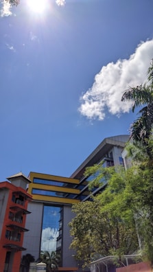 The exterior of manriqueagency llc’s contemporary office building on a bright day.