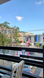Balcony view overlooking the busy nightlife and commercial areas around the apartment complex.