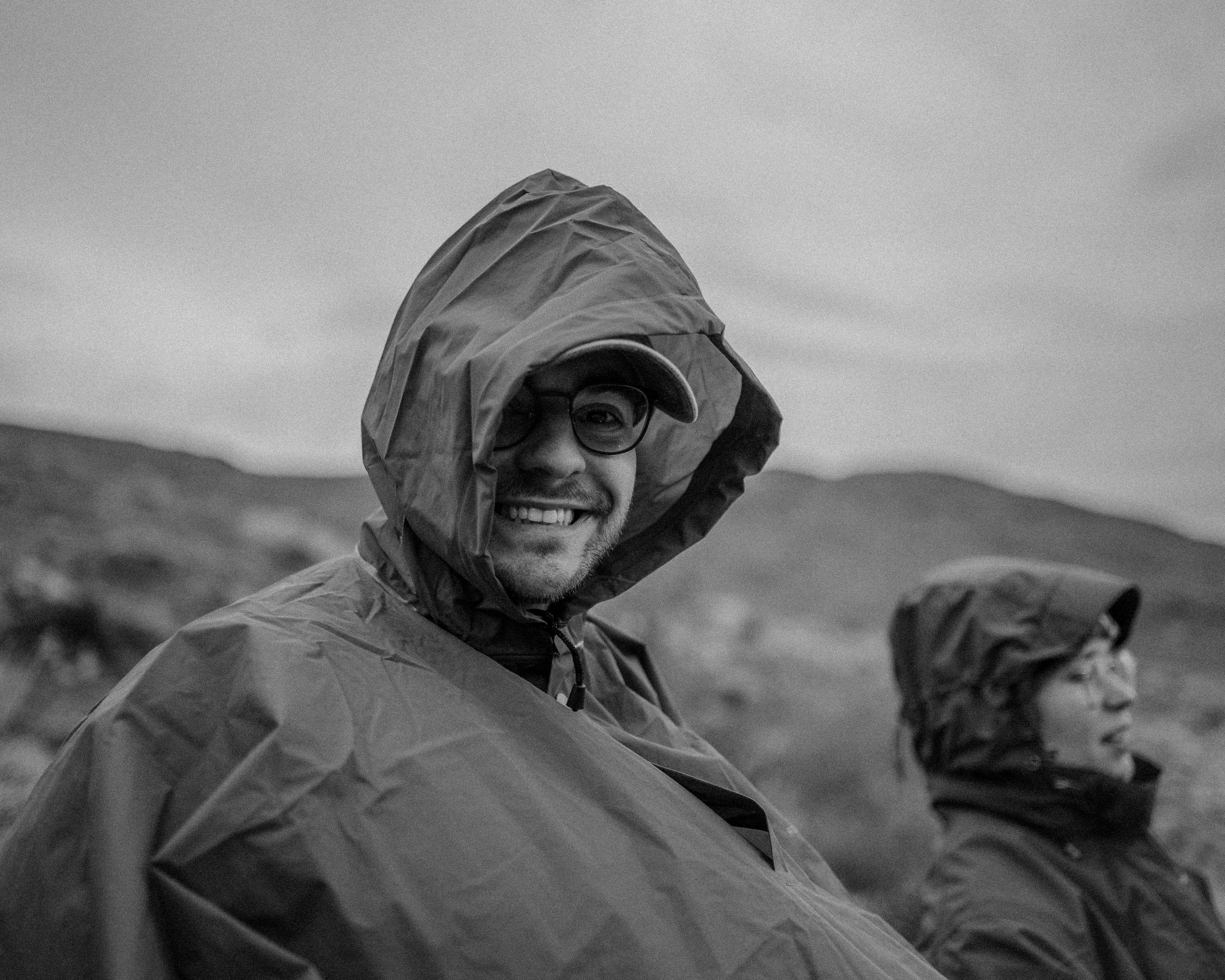 A man wearing a rain coat and a hat photo Free Coat Image on Unsplash