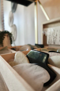 Display of various sharpening stones and tools available for sale.