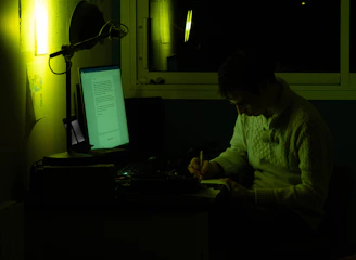 A focused writer crafting compelling campaign messages at a desk.