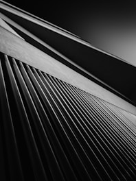 Abstract black and white architectural form suggesting upward progress and clarity.