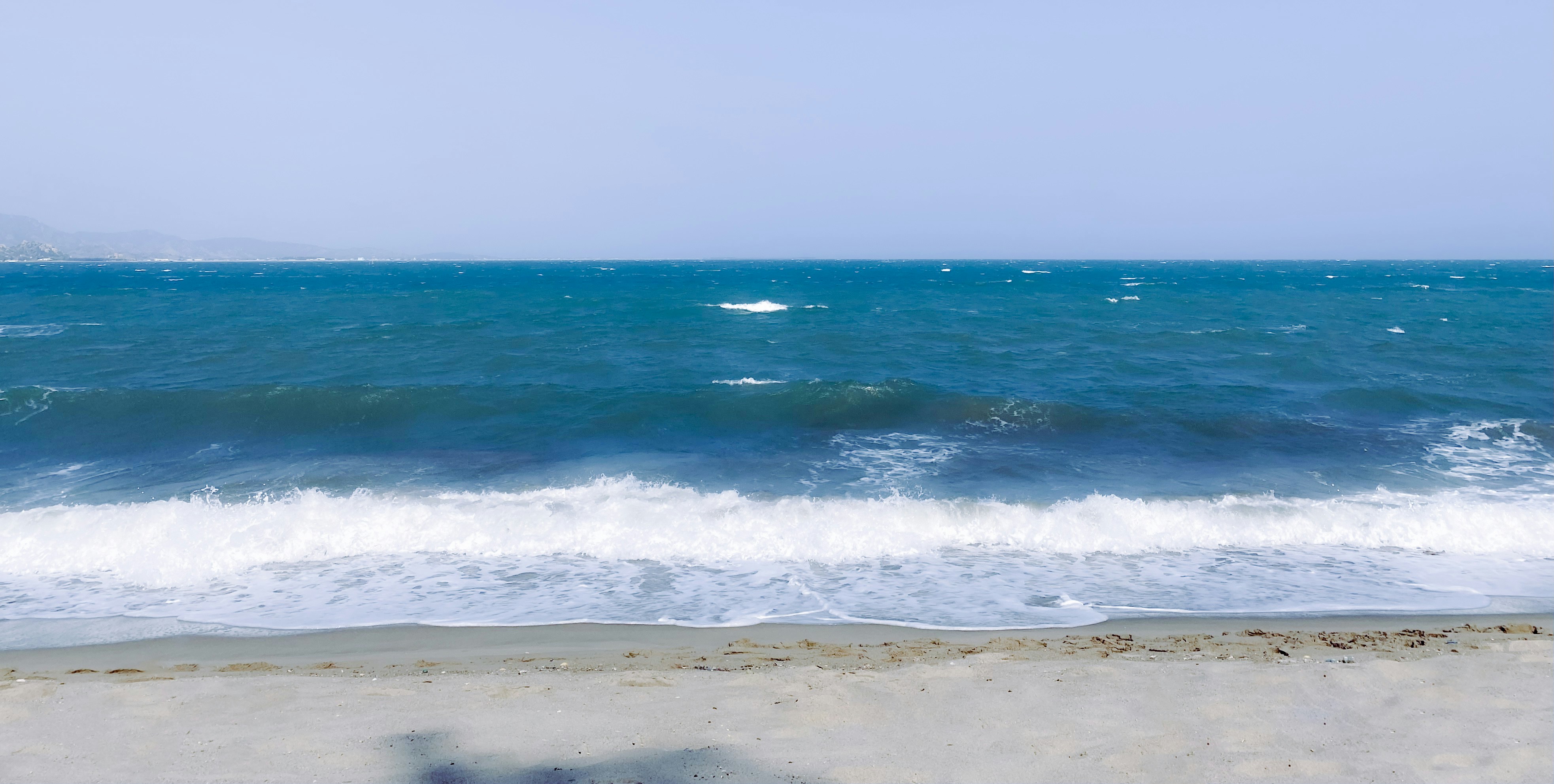 a view of a body of water from a beach