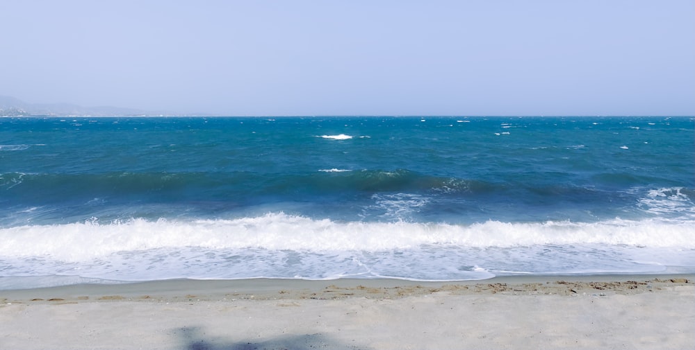 a view of a body of water from a beach