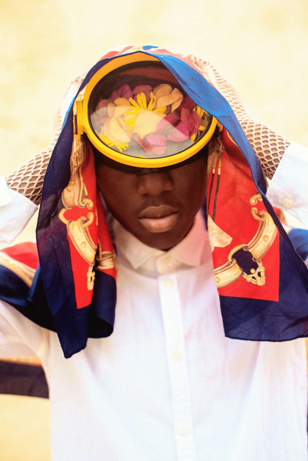 a man in a white shirt and a colorful hat