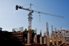 a construction site with a crane in the background
