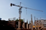 a construction site with a crane in the background