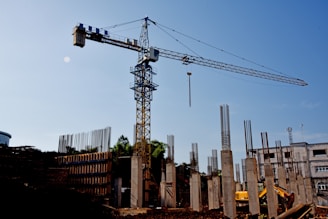 a construction site with a crane in the background