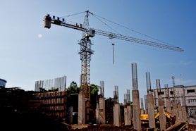 a construction site with a crane in the background