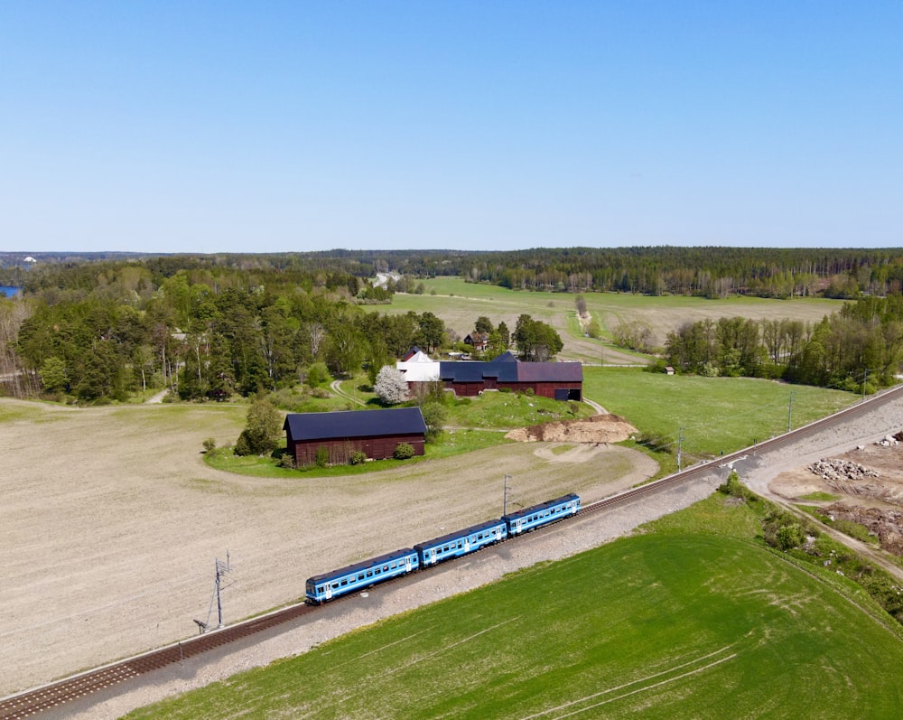 a train traveling through a rural country side