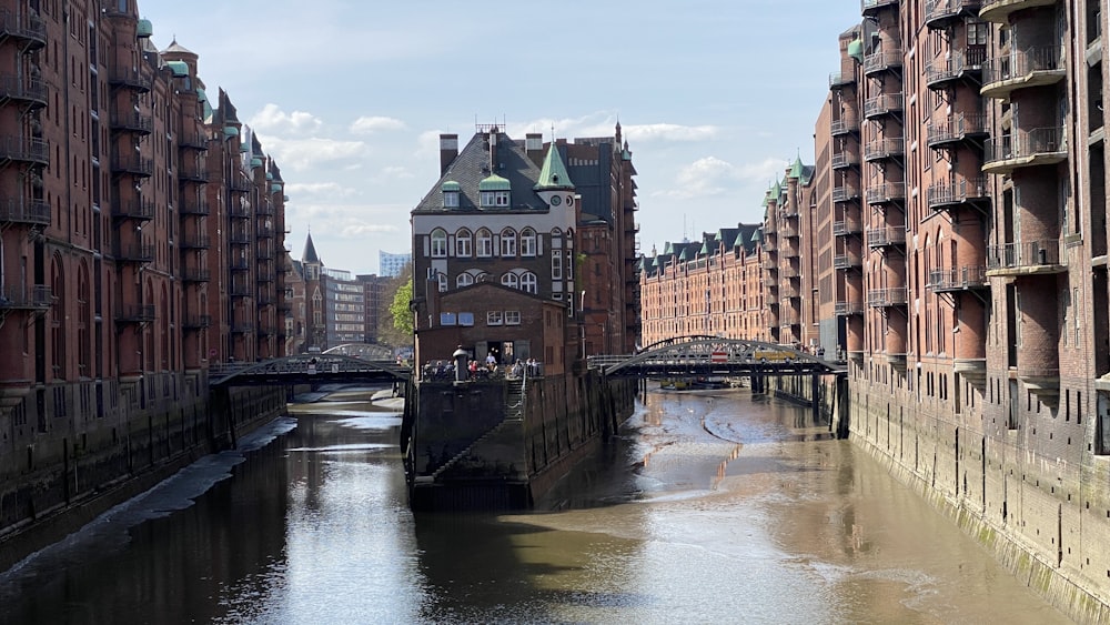 a river running through a city next to tall buildings