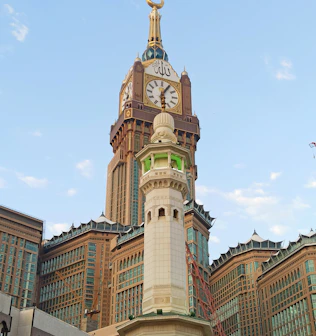 a tall building with a clock on the top of it