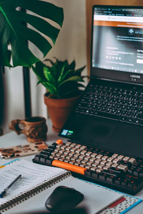 a laptop computer sitting on top of a desk