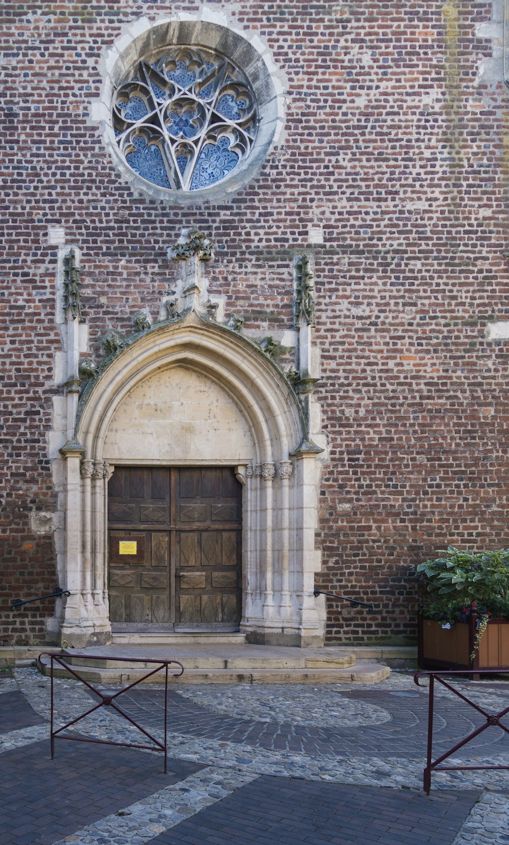 a large brick building with a wooden door