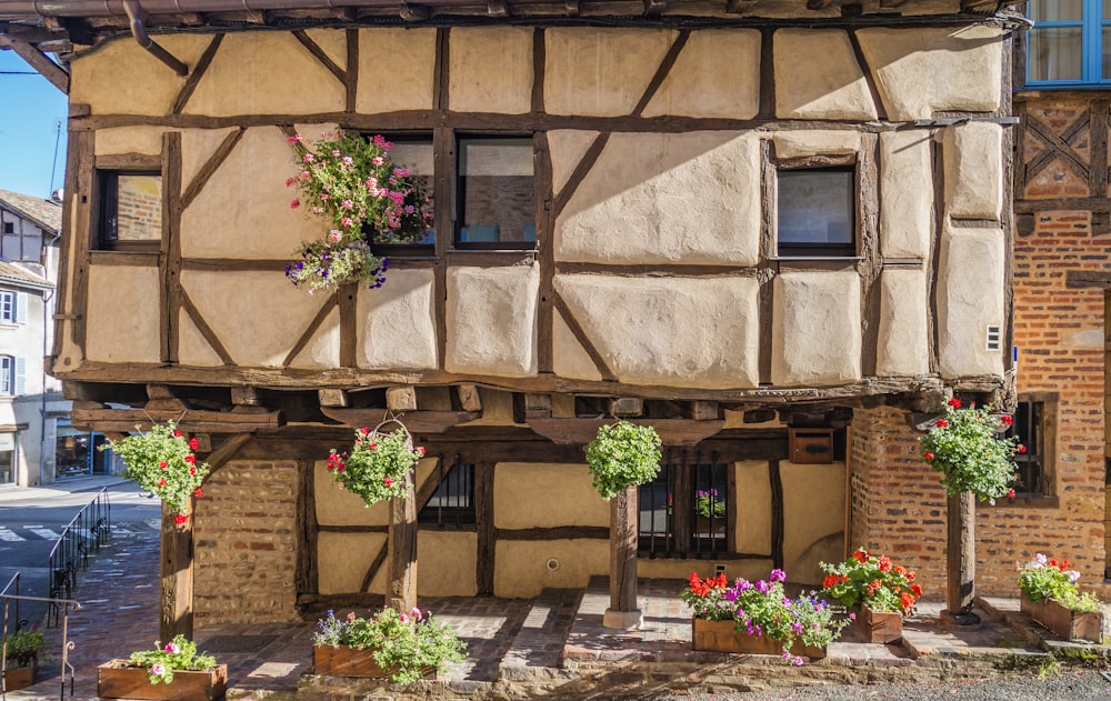 a building with flowers on the outside of it