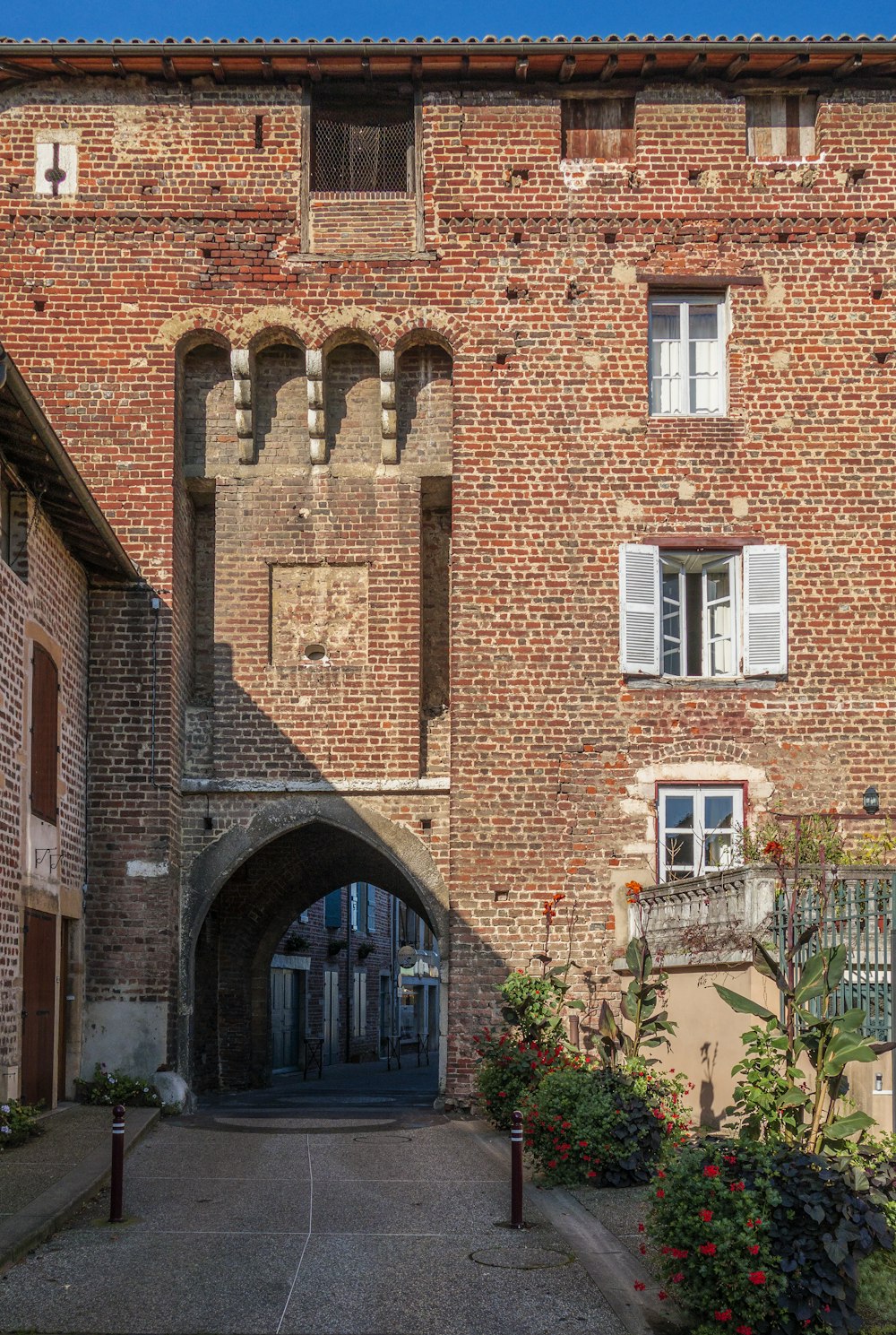 a brick building with a large arched doorway