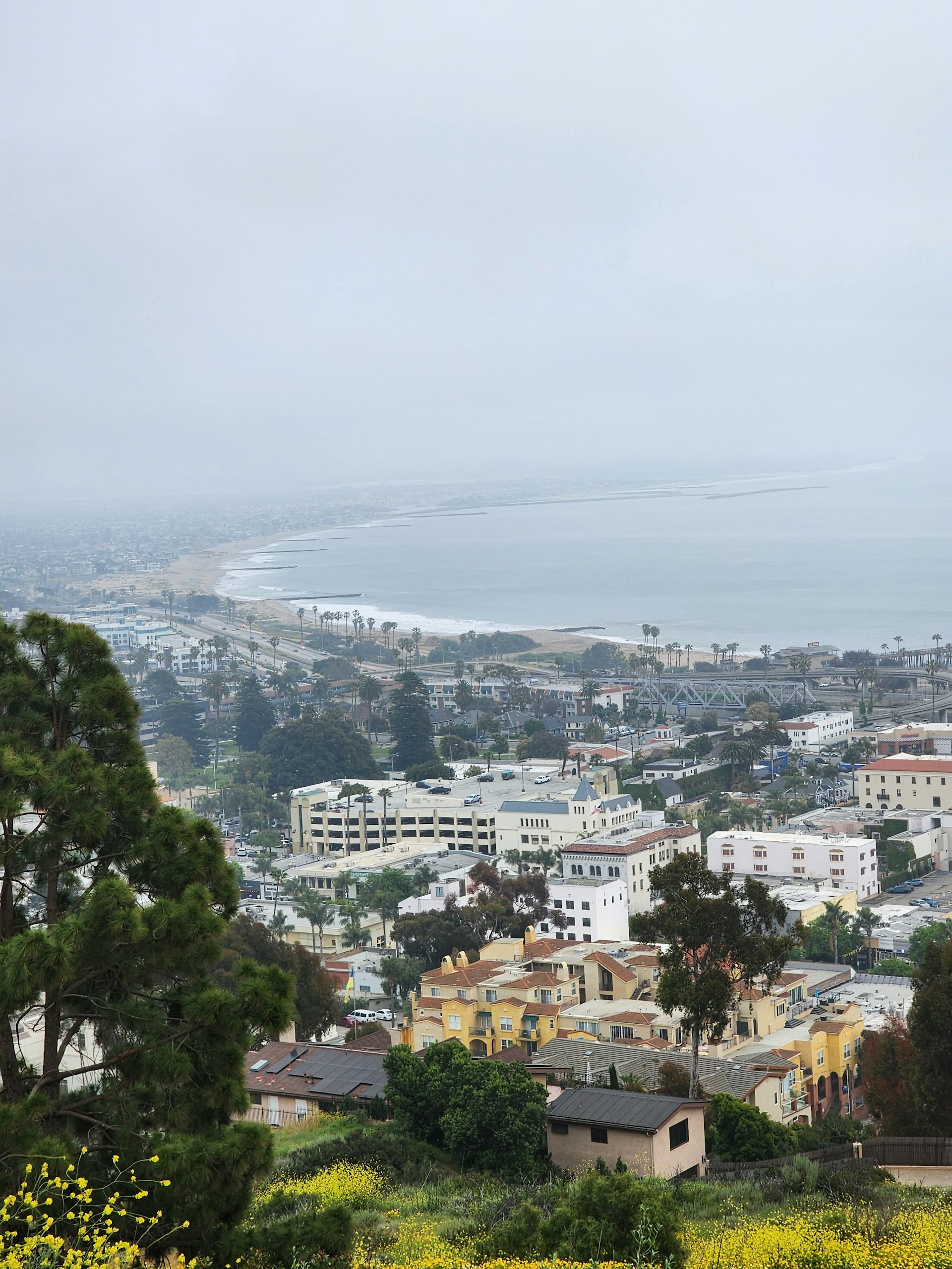 a view of a city with a body of water in the distance