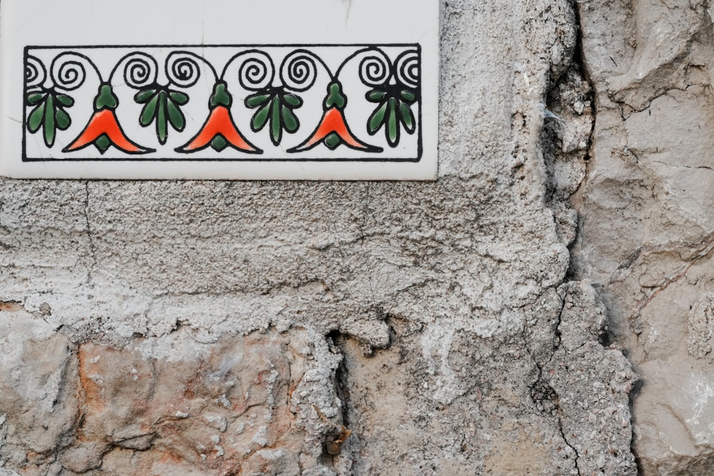 a close up of a decorative tile on a wall