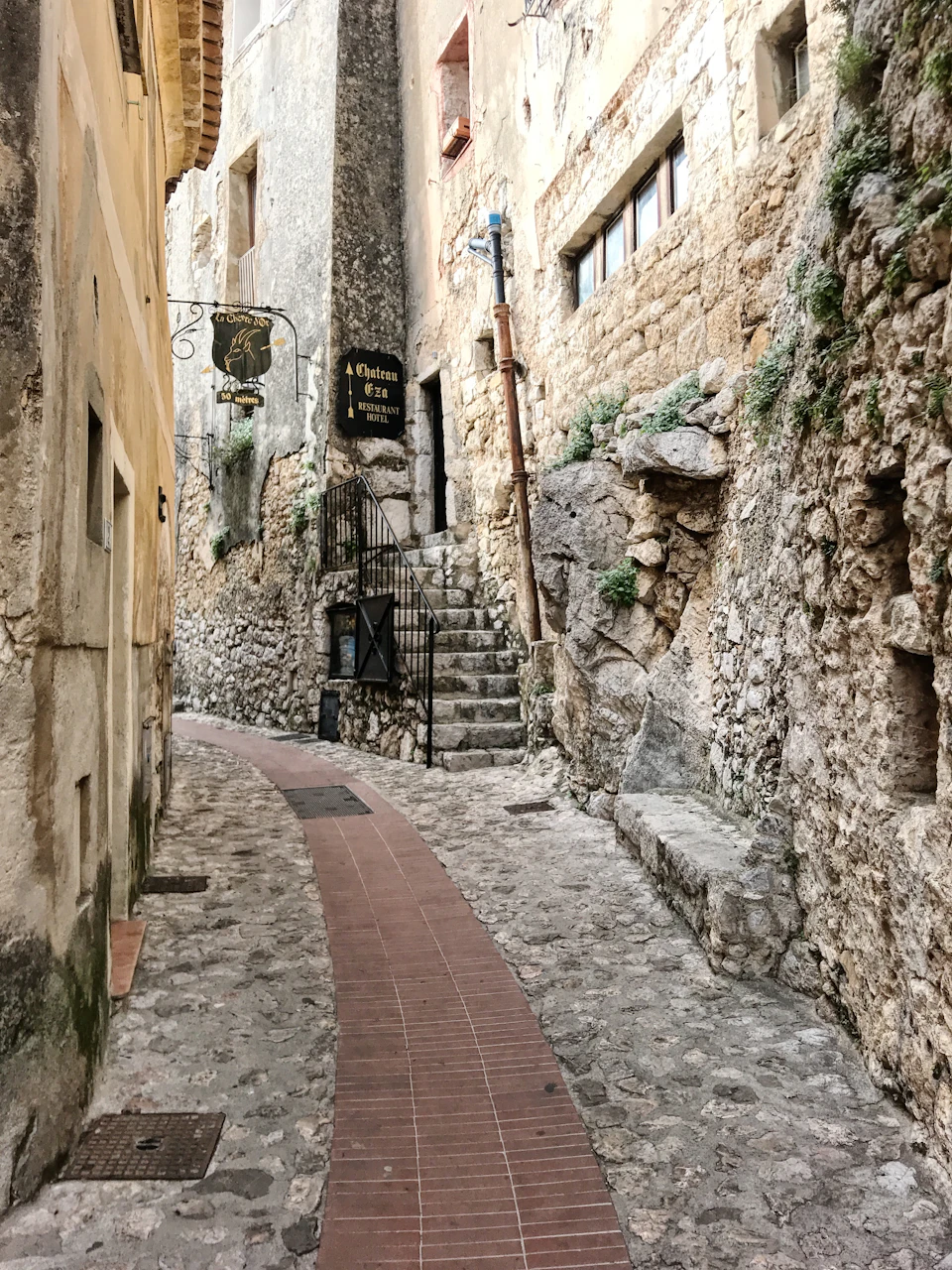 Medieval stone lane with old shopfronts in a historic French town