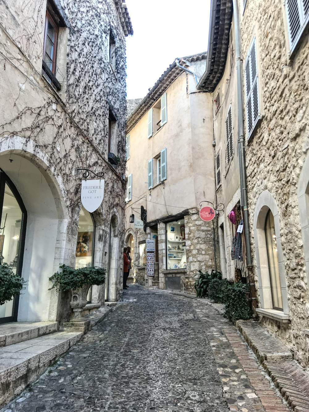 a cobblestone street in a small town