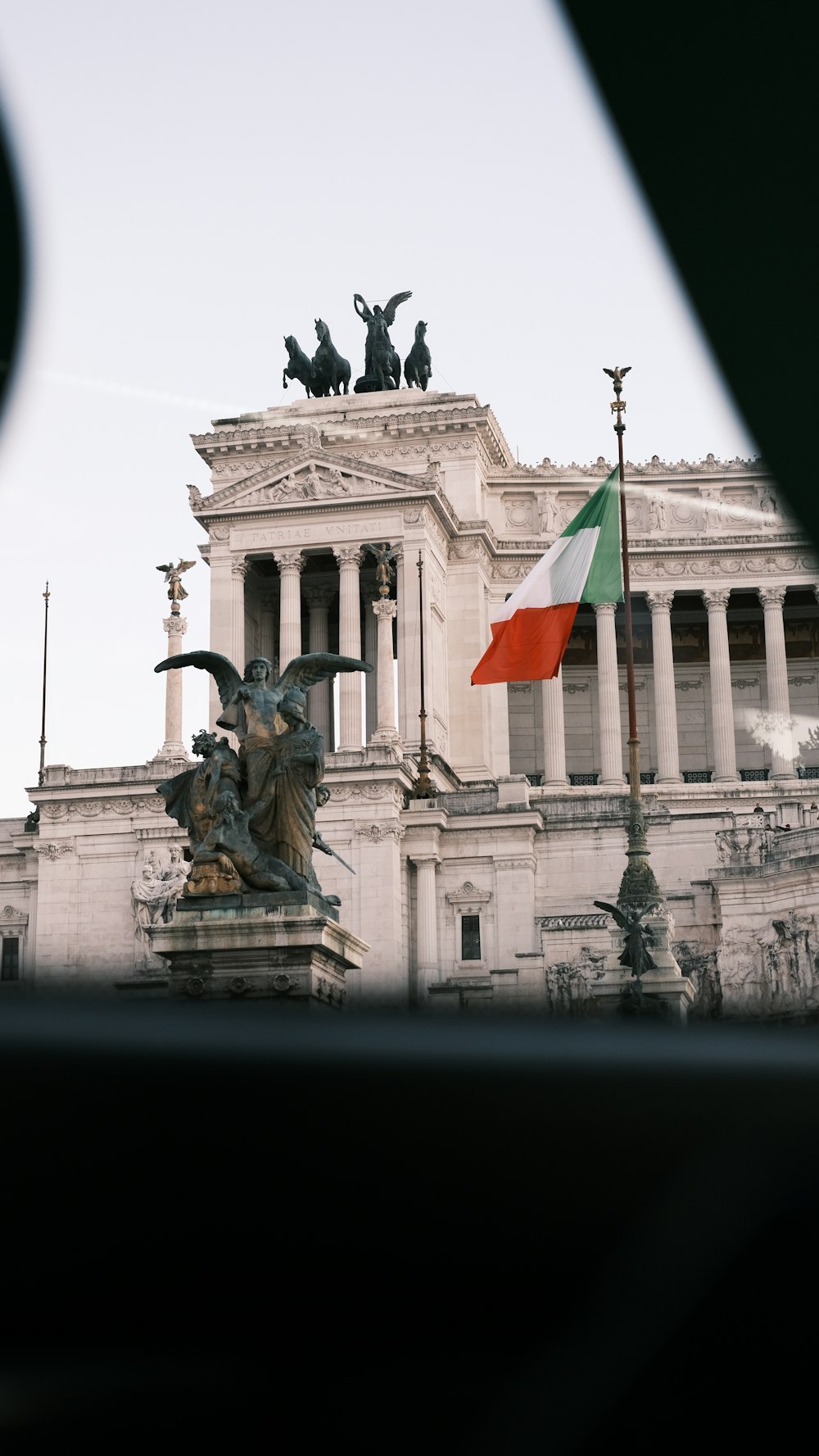 a building with a flag flying in front of it