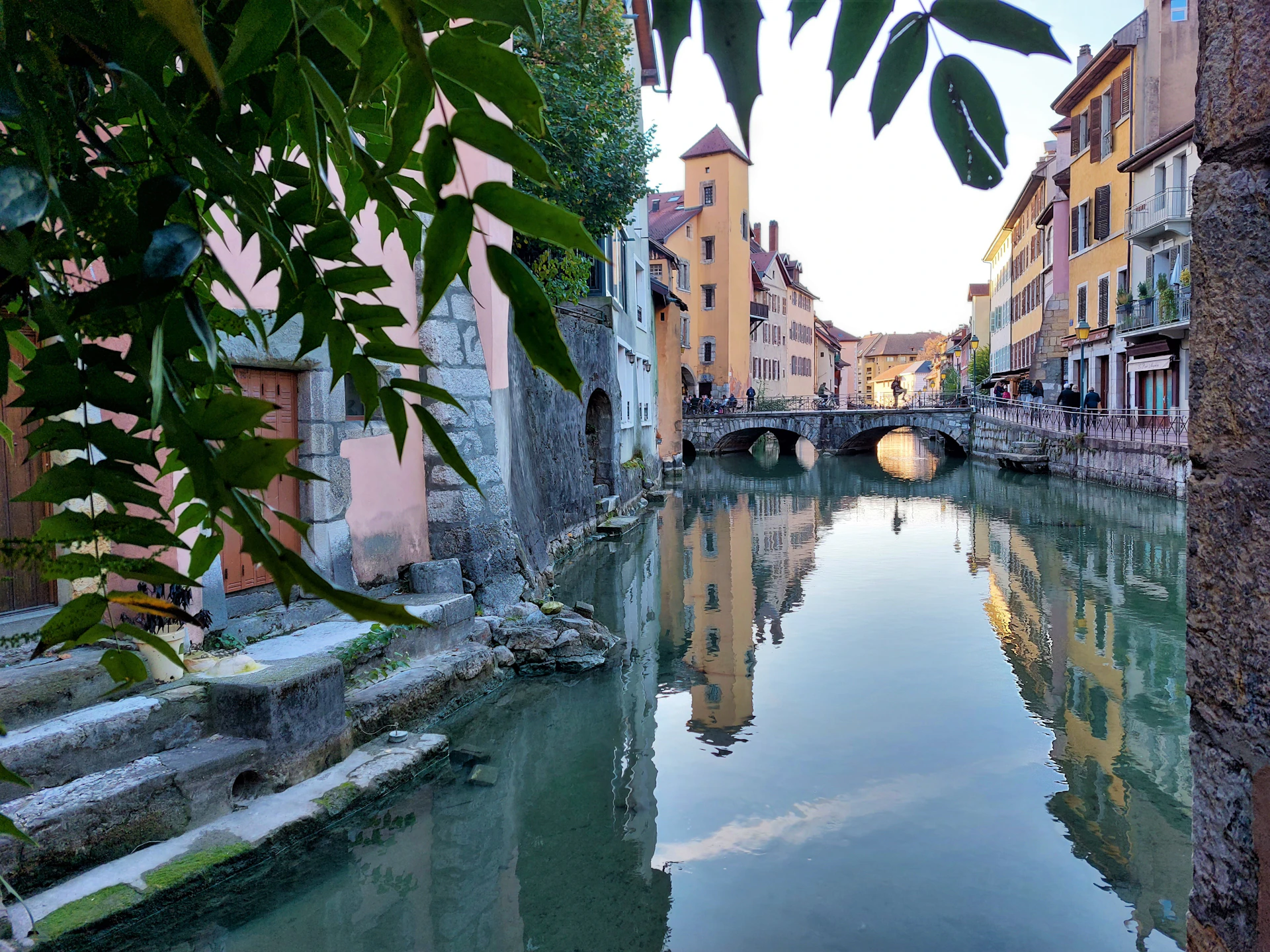 a river running through a city next to tall buildings