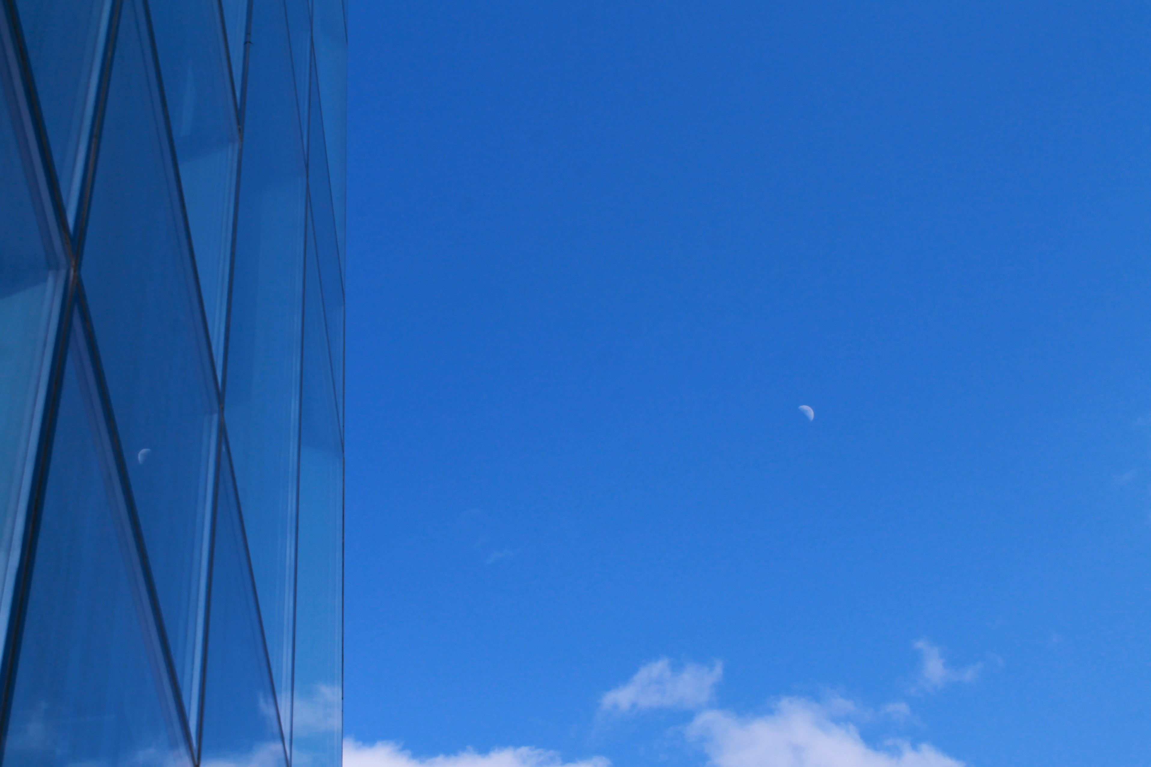 a tall building with a blue sky in the background
