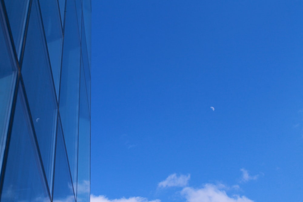 a tall building with a blue sky in the background