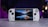 A handheld gaming console with a central screen displaying a scenic wallpaper of mountains and a lake, flanked by controller buttons and joysticks on both sides. The lighting around is dim, with purplish hues in the background, creating a modern and elegant atmosphere.
