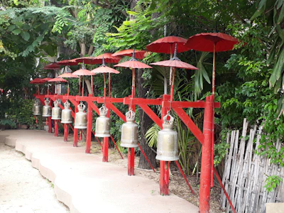 A set of metal chimes hanging gently, ready to release soothing tones.